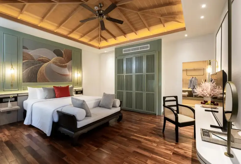 Elegant suite bedroom at La Solaya Khao Lak with rich textures