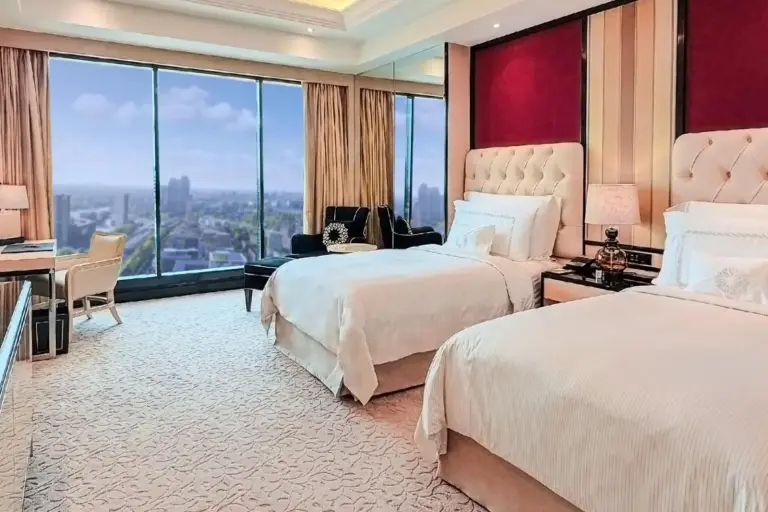 Twin bed room at The Trans Luxury Hotel Surabaya with modern design